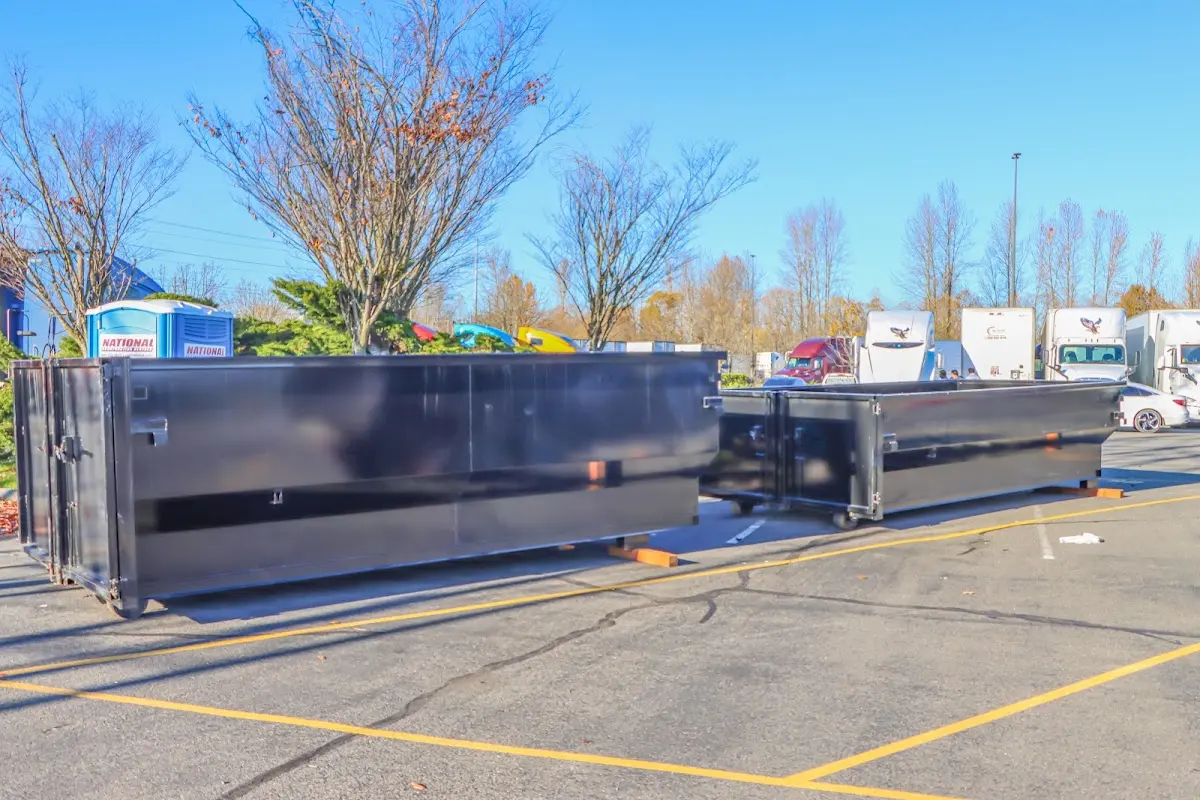 Professional dumpster rental service with roll-off container on residential driveway in Calumet Park